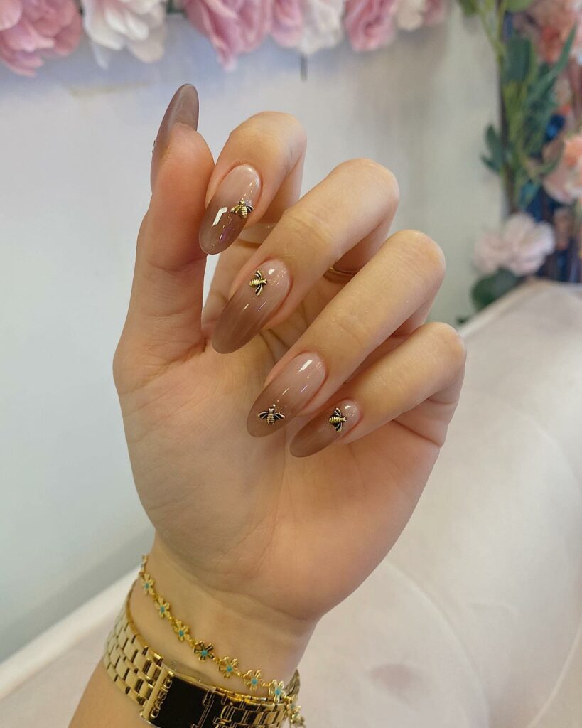 20 Latest Nude Ombre Nail Ideas To Try In 2024! 21 Nude And Brown Ombre Nails With Bees Design