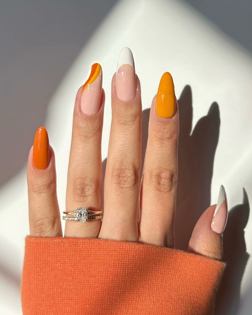 20 Latest Candy Corn Nail Design To Try In 2024! 10 Almond Nails With Candy Corn Tips
