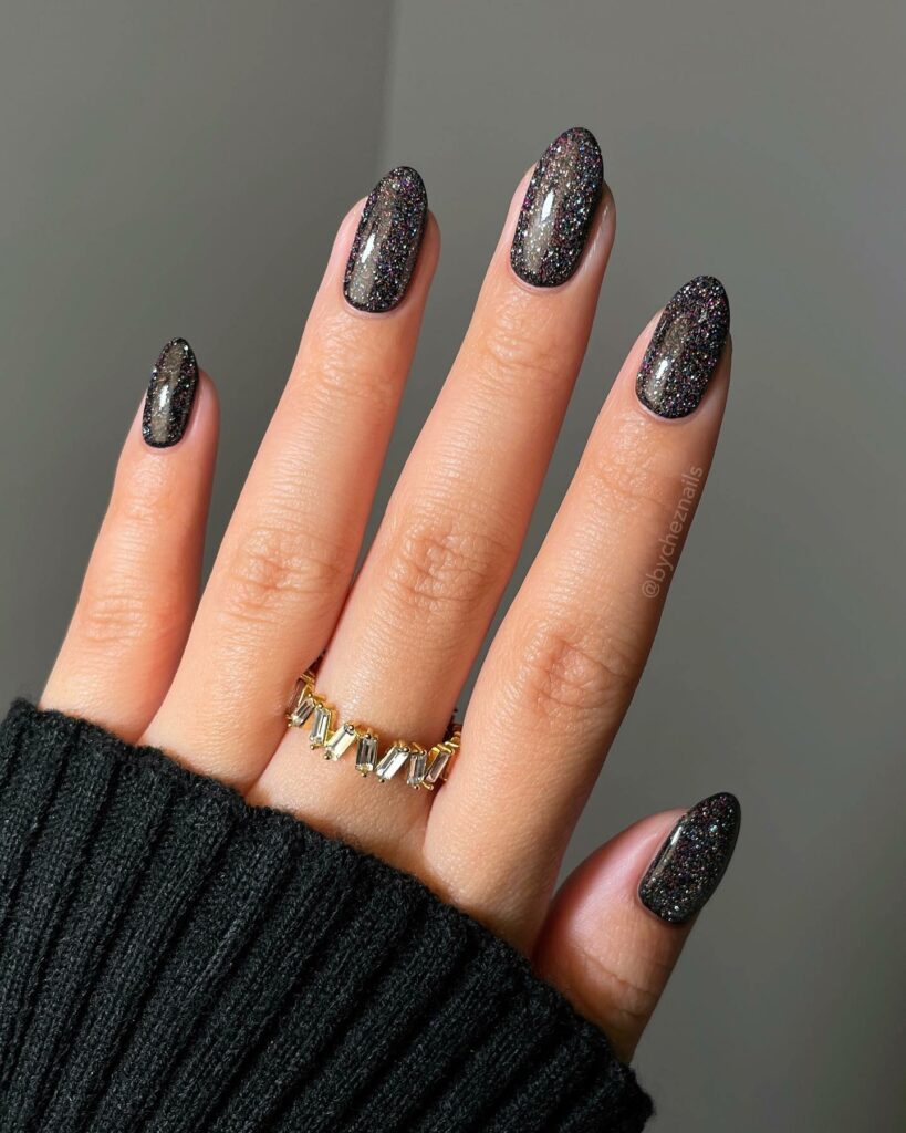 19 Latest Black Glitter Nail Designs To Try In 2024! 24 Black Glitter Almond Nails