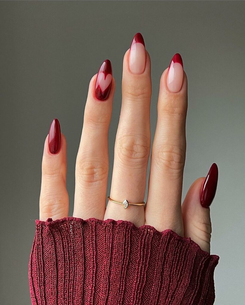 20 Latest Red Almond Nail Ideas To Try In 2024! 16 Abstract Dark Red French Almond Nails With Heart