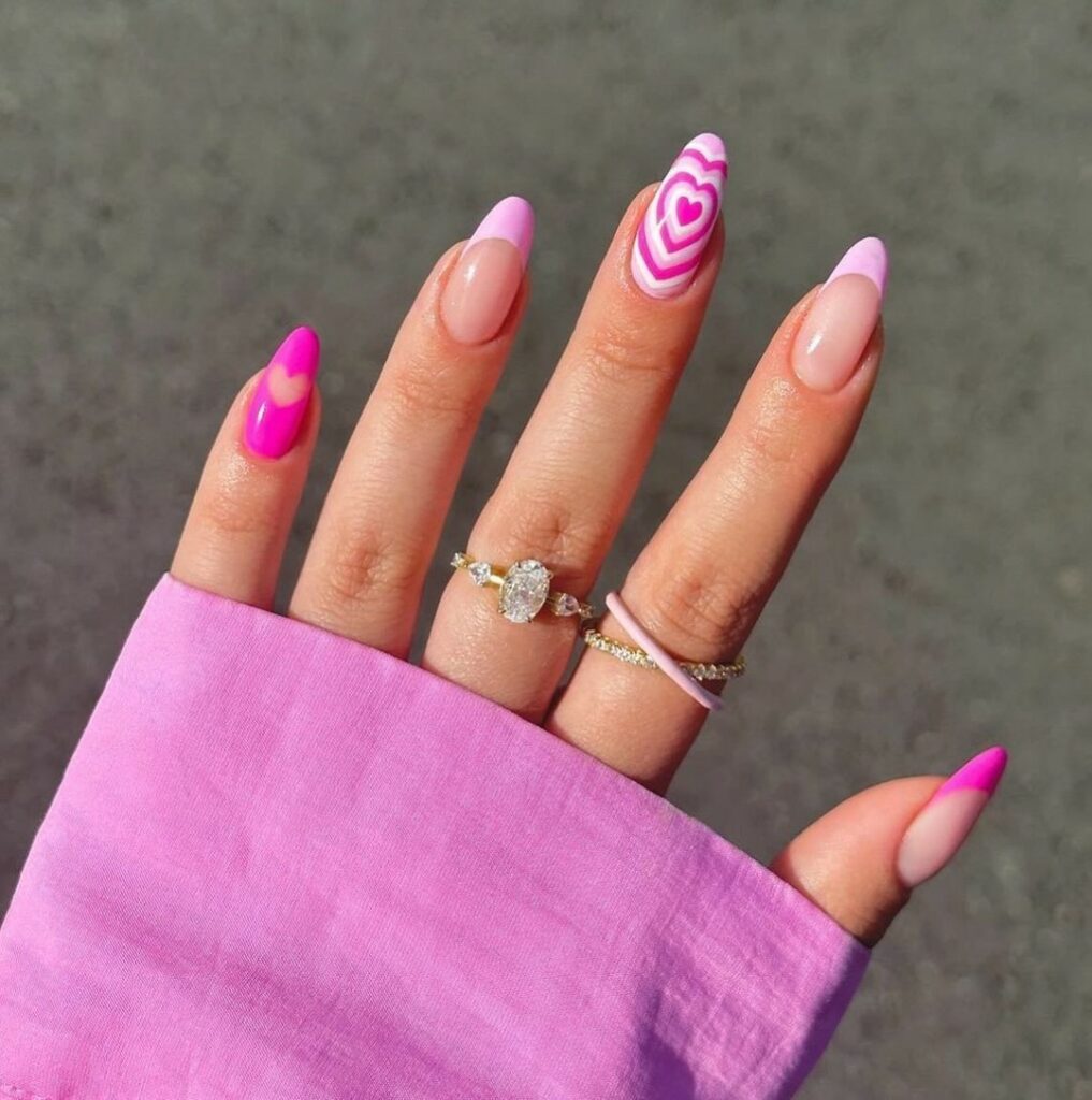 27 Romantic Nail Designs to Try for Valentine's Day 2024! 11 Love Hypnotized: Neon Pink Extravaganza