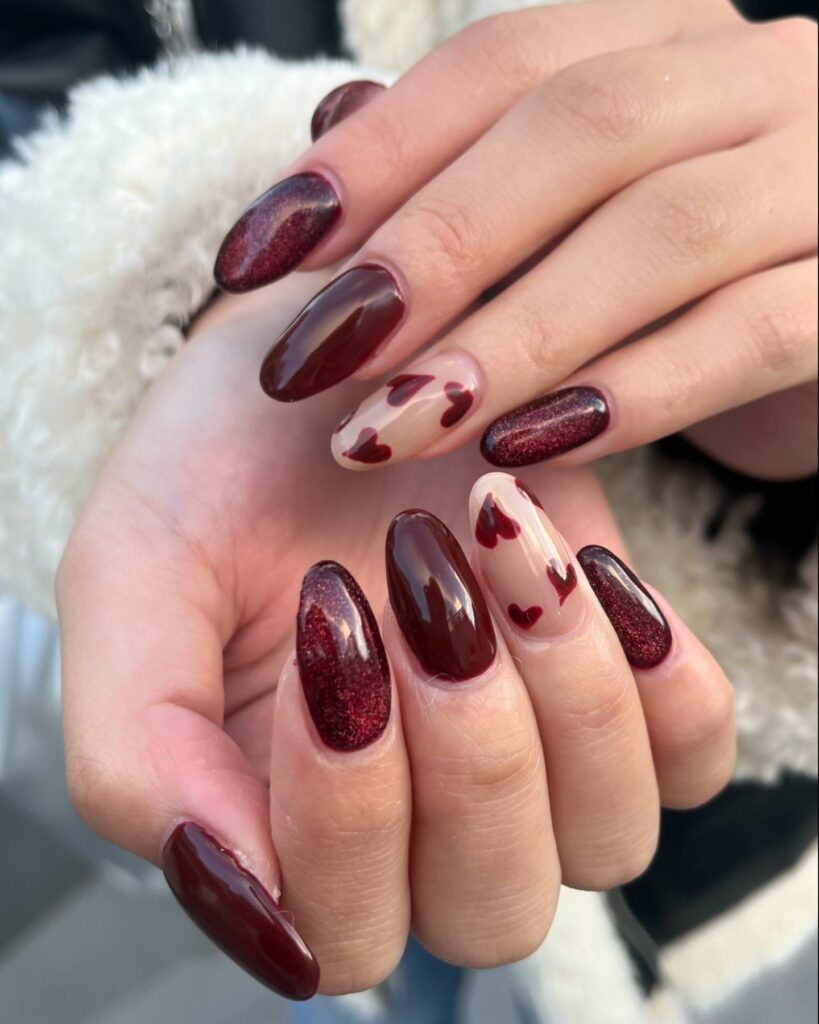27 Romantic Nail Designs to Try for Valentine's Day 2024! 14 Burgundy Bliss with Shimmering Hearts