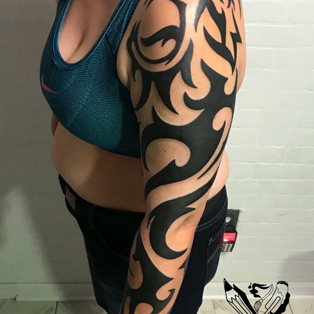 10 BEST SLEEVE TATTOOS FOR WOMEN IN 2024 13 Tribal Sleeve Tattoo