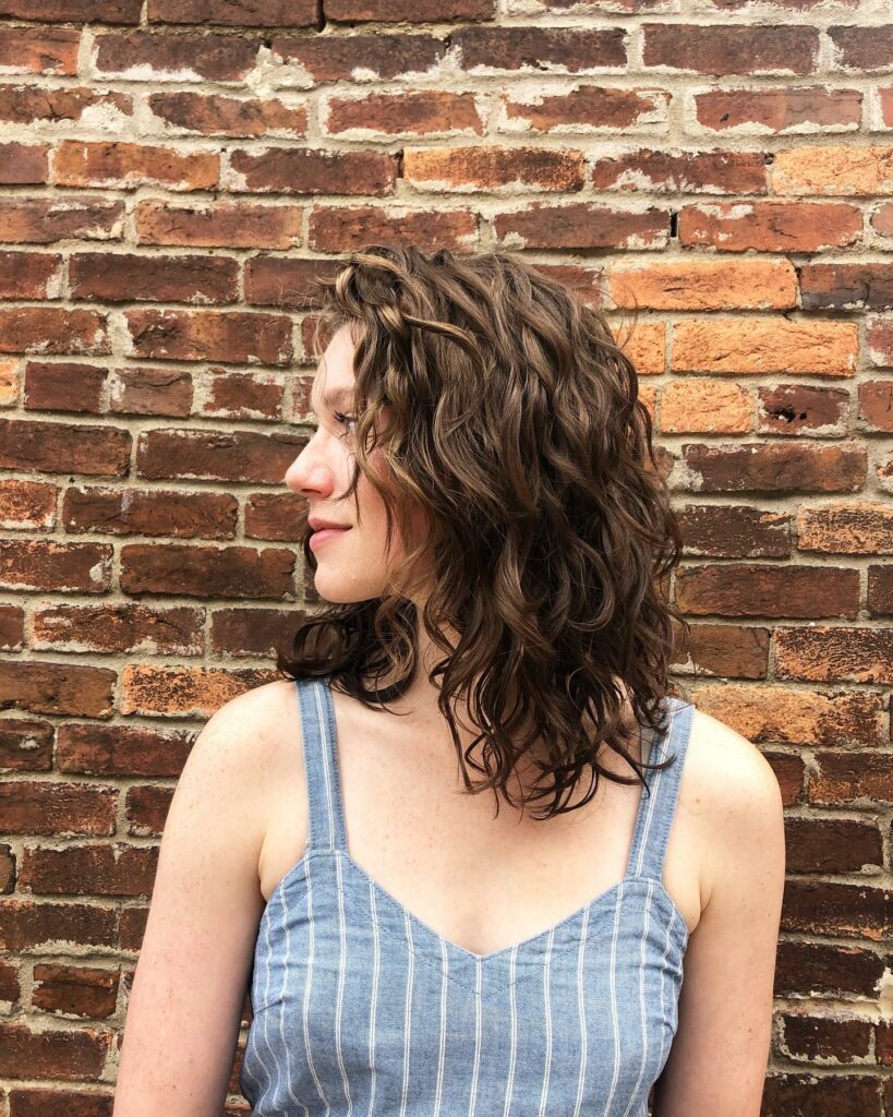 25 Curly Hair Perm Ideas to Transform Your Look in 2024 20 Medium Shaggy Perm with Bangs