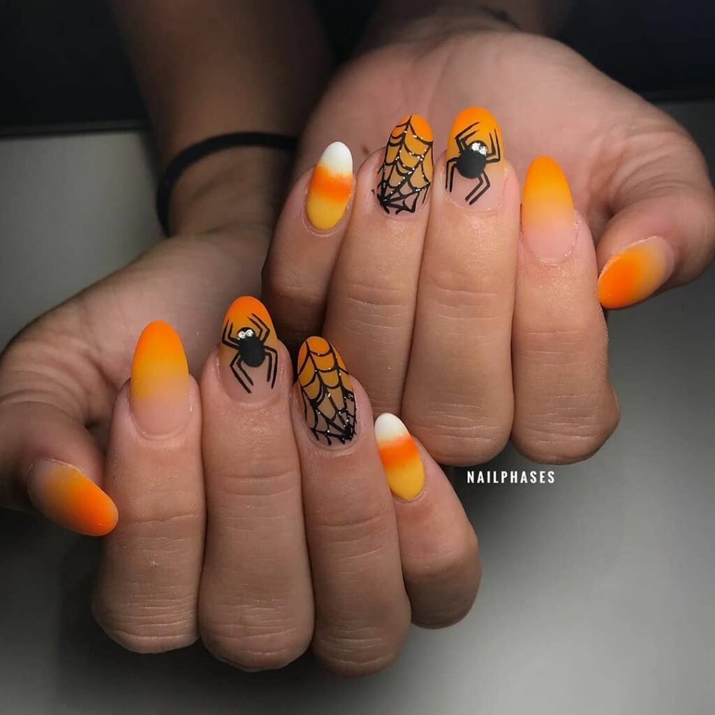 20 Latest Candy Corn Nail Design To Try In 2024! 27 Matte Candy Corn Nails With Spider Design
