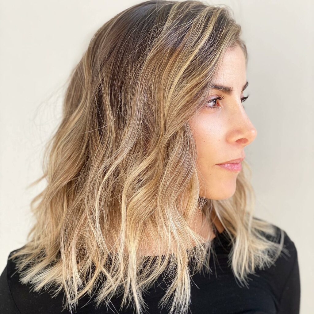 30 Medium Length Hairstyles Blonde Ideas to Try in 2024 23 Windswept Mid-Length Cut