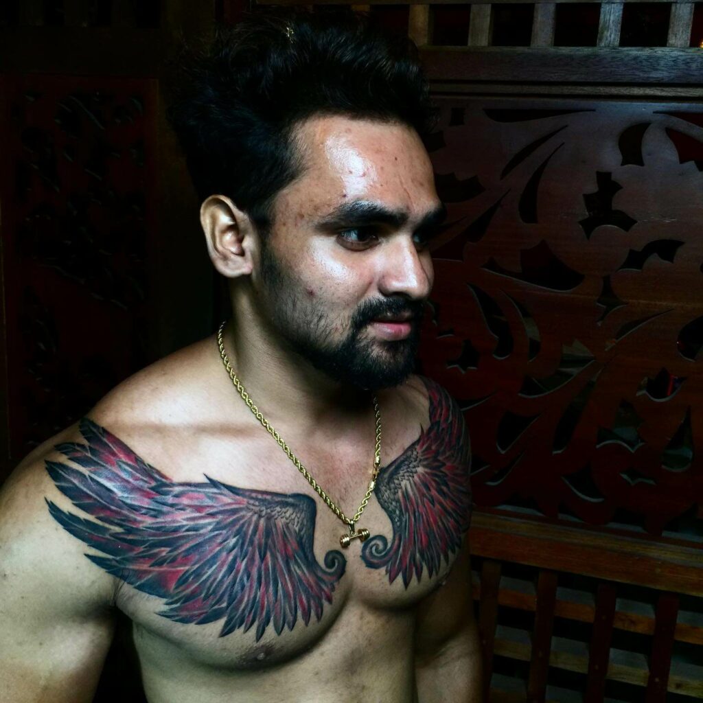 11+ Chest Wing Tattoo Ideas That Will Blow Your Mind! 16 Demon Wings Tattoo Done In Red And Black Ink