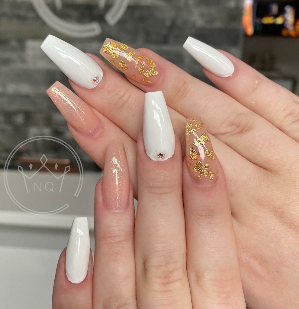 30 Latest White And Gold Nail Ideas To Try In 2024! 28 White Coffin Nail With Stones And Gold Foils