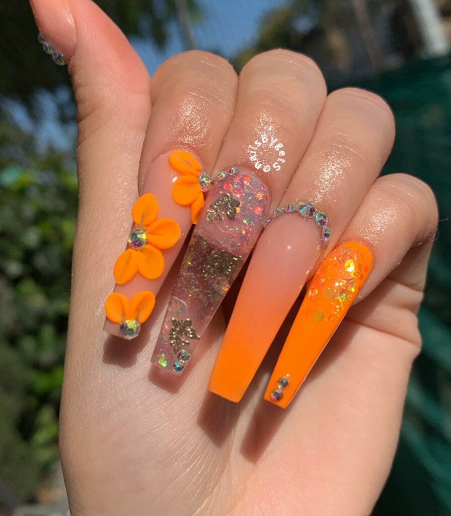 30 Latest Orange Ombre Nail Designs To Try In 2024! 15 Orange Ombre Nails With Glitter, Rhinestones And 3D Flower Design
