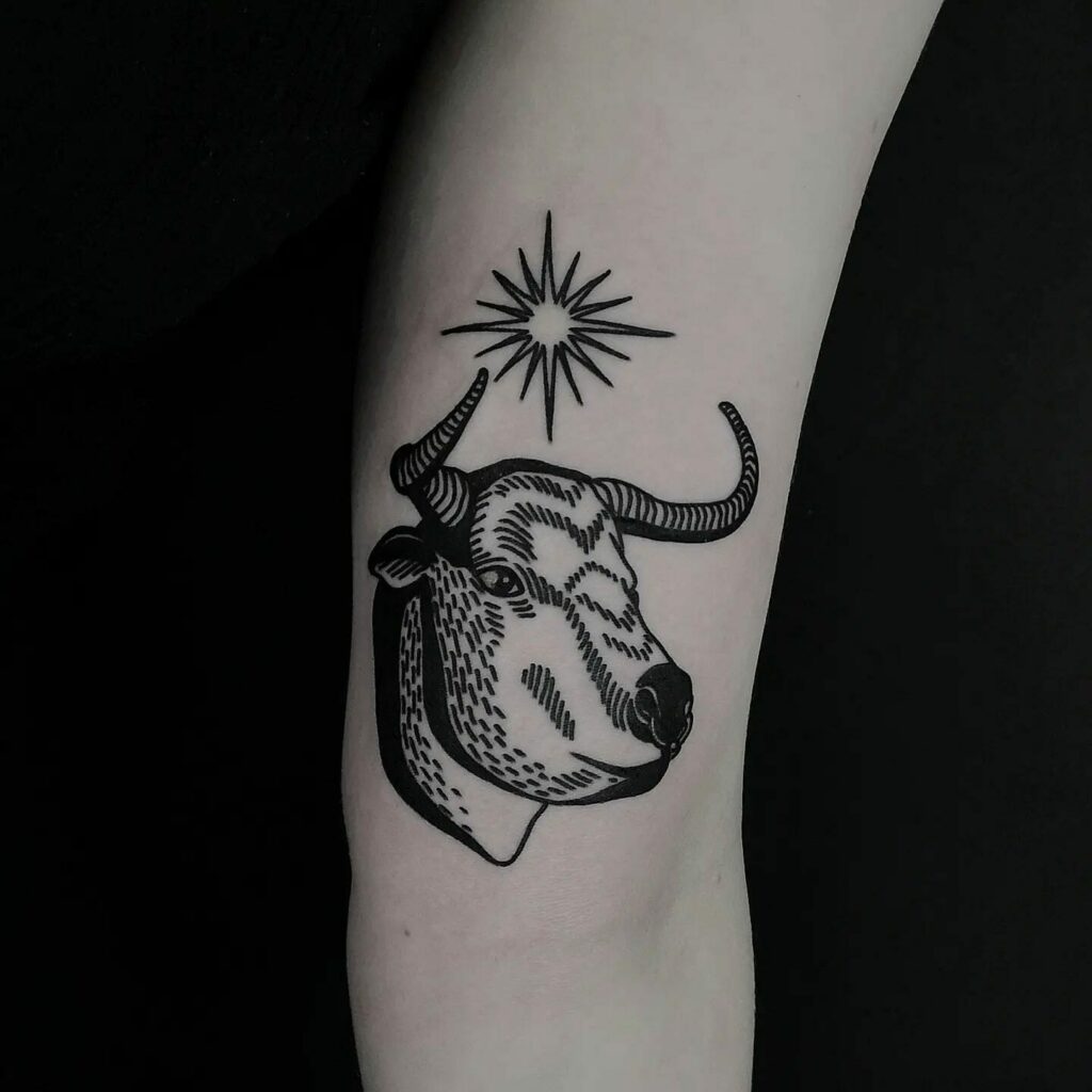11+ Taurus Tattoo Simple Ideas That Will Blow Your Mind! 16 A Blackwork Bull and Stars Tattoo