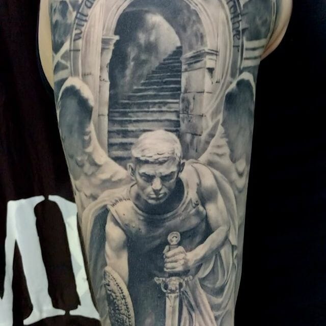 14+ Guardian Angel Tattoo Ideas You Have To See To Believe! 19 A Tattoo Of A Warrior Angel’s Statue