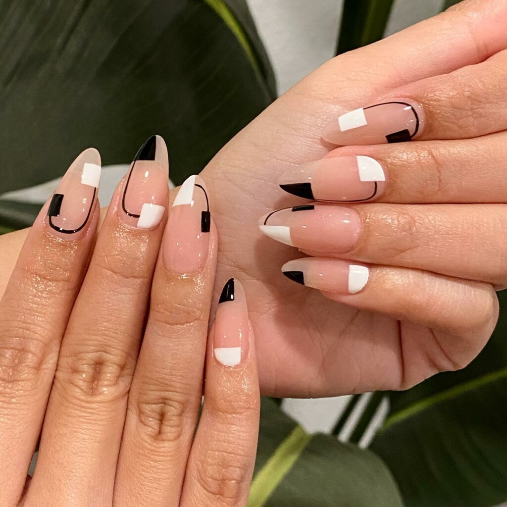 30 Latest Black Almond Nail Ideas To Try In 2024! 24 Black Almond-Shaped Nails with Creative Patterns