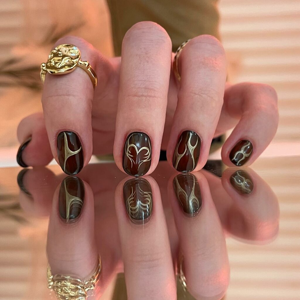 Fall in Love with 57 Short Fall Nail Designs in 2024 29 Abstract Brown Short Fall Nails with Gilded Gold
