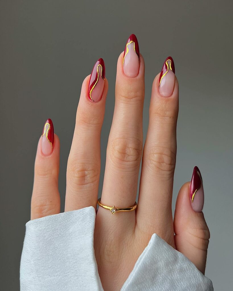 Shine Bright with 30 Red and Gold Christmas Nail Ideas in 2024 10 Abstract French Red and Gold Christmas Nails