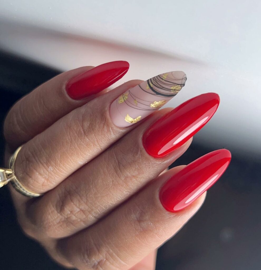 34 Latest Red and Gold Nail Designs To Try In 2024! 17 Abstract Stripes Red and Gold Nails