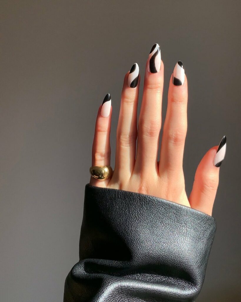 30 Latest Black Almond Nail Ideas To Try In 2024! 11 Whimsical Abstract Swirls on Black Almond Nails