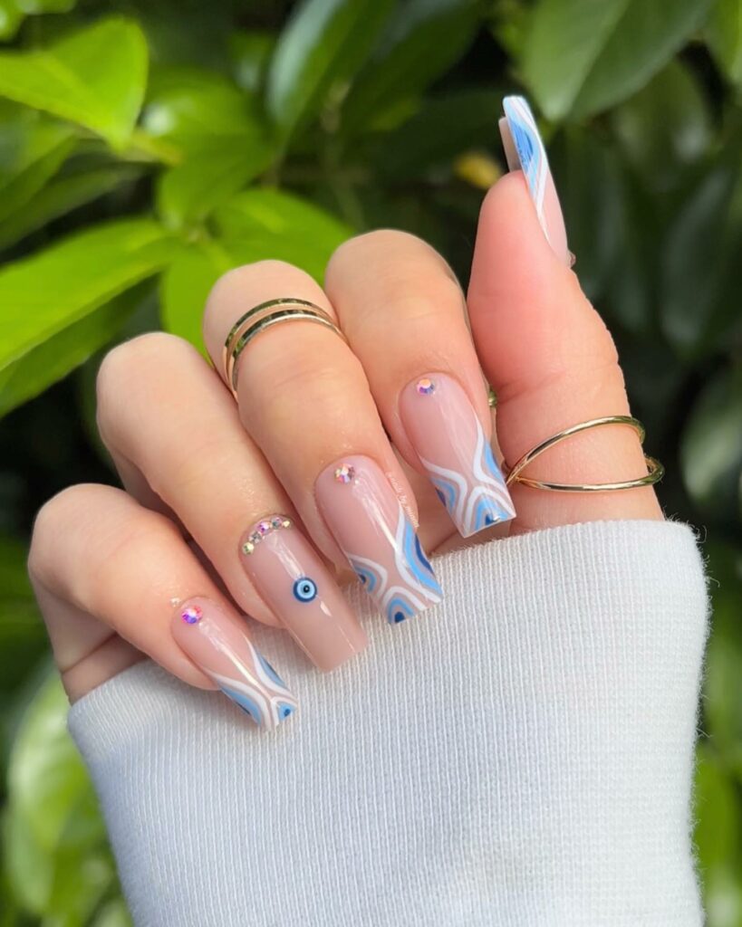 Channel Mystique with 20 Evil-Eye Nail Designs for 2024 15 Abstract evil eye nails