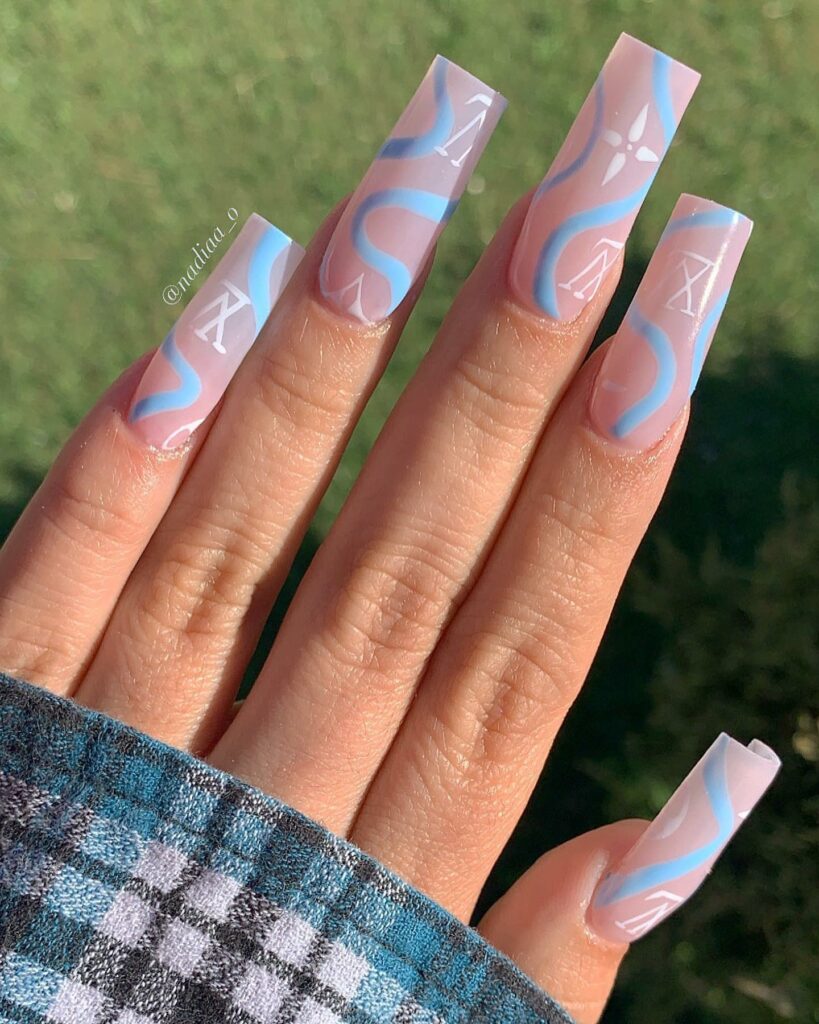 25 Latest Louis Vuitton Nails To Try In 2024 18 Acrylic Ombré Nails with Blue Swirls and Louis Vuitton