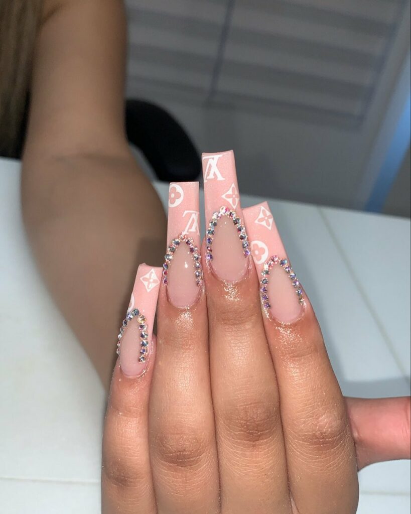 25 Latest Louis Vuitton Nails To Try In 2024 15 Acrylic Pink Ombré Nails with Louis Vuitton Motifs