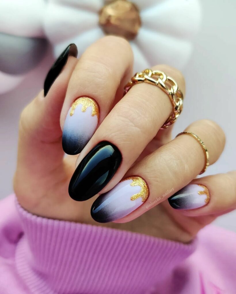 20 Latest Black Christmas Nails Ideas To Inspire You In 2024! 18 Almond Black Christmas Nails with Gold Foils