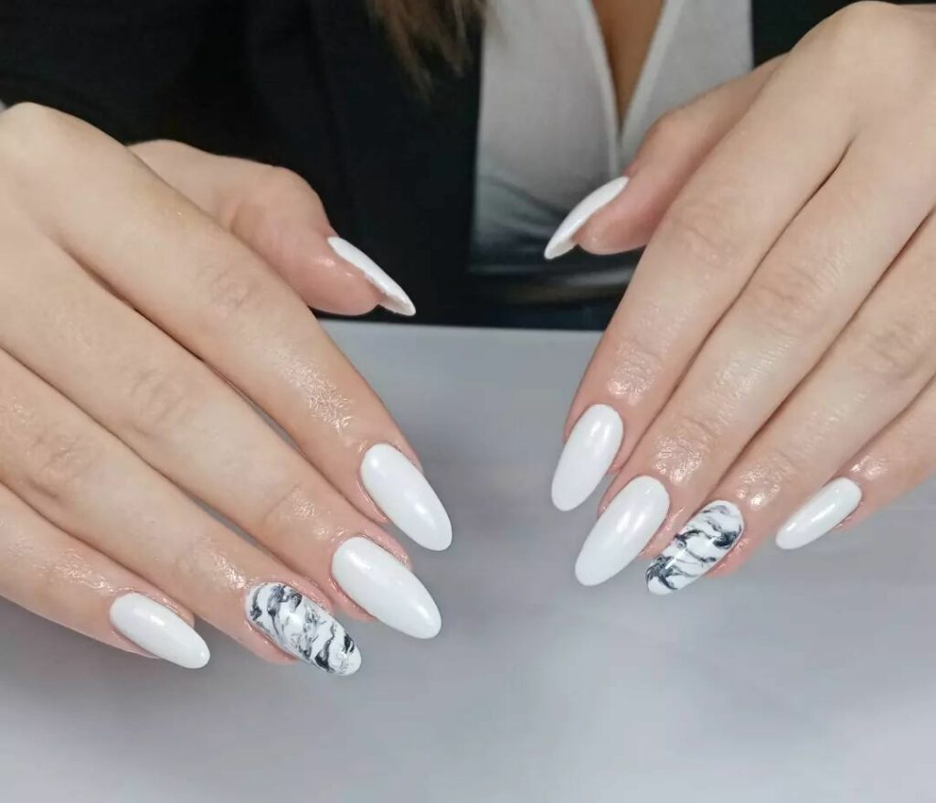 Embrace Elegance with 15 White Marble Nail Designs in 2024 19 White And Black Marble Accent Nails