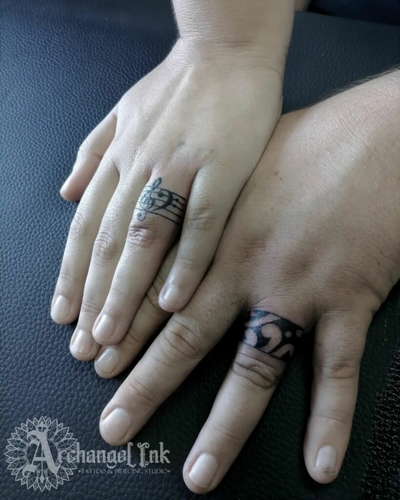 10 Best Wedding Ring Tattoo Ideas - Updated For 2024 15 Music Themed