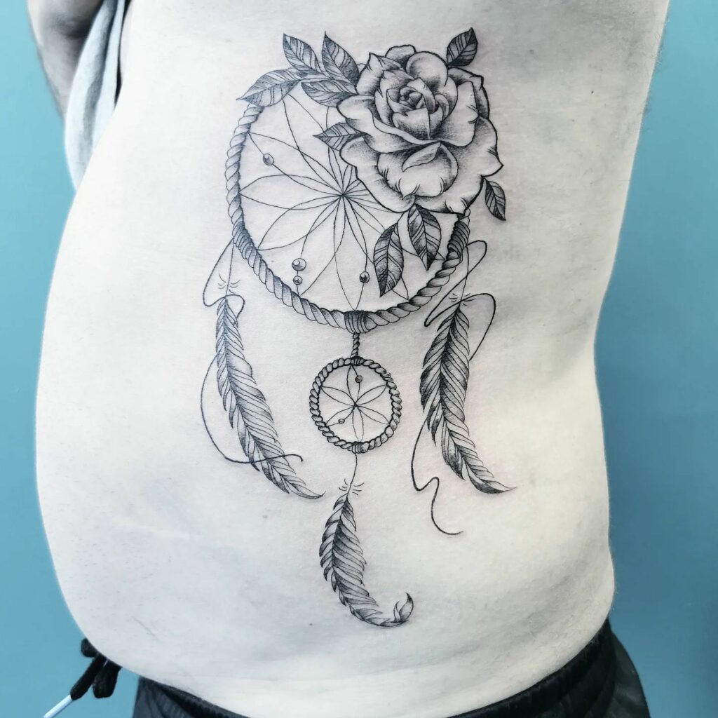 TOP 10 RIB TATTOOS DESIGNS FOR 2024 12 Dream Catcher Rib Tattoo