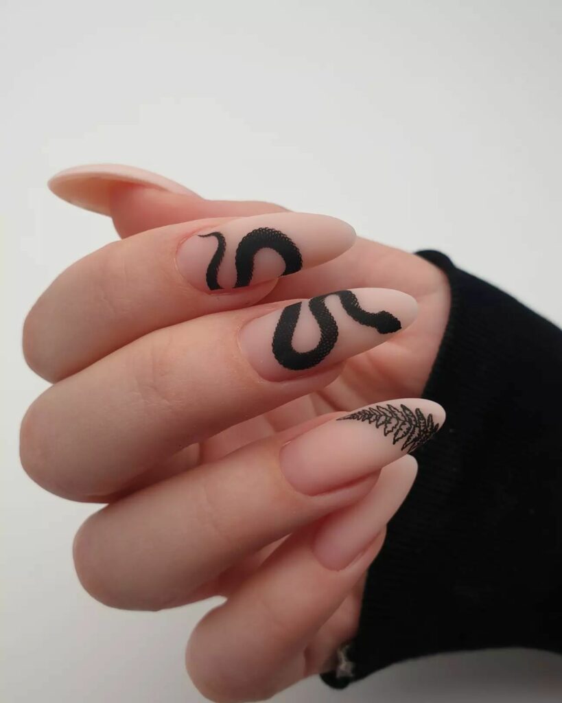 30 Latest Snake Nail Designs To Try In 2024! 27 Black Snake Design On A Matte Nude Nails