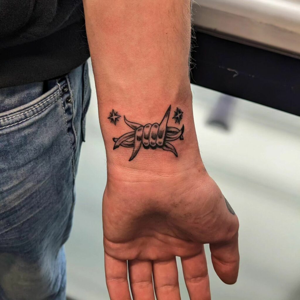 12 Amazing Barbed Wire Tattoos & Their Meanings 19 Barbed wire on wrist tattoo