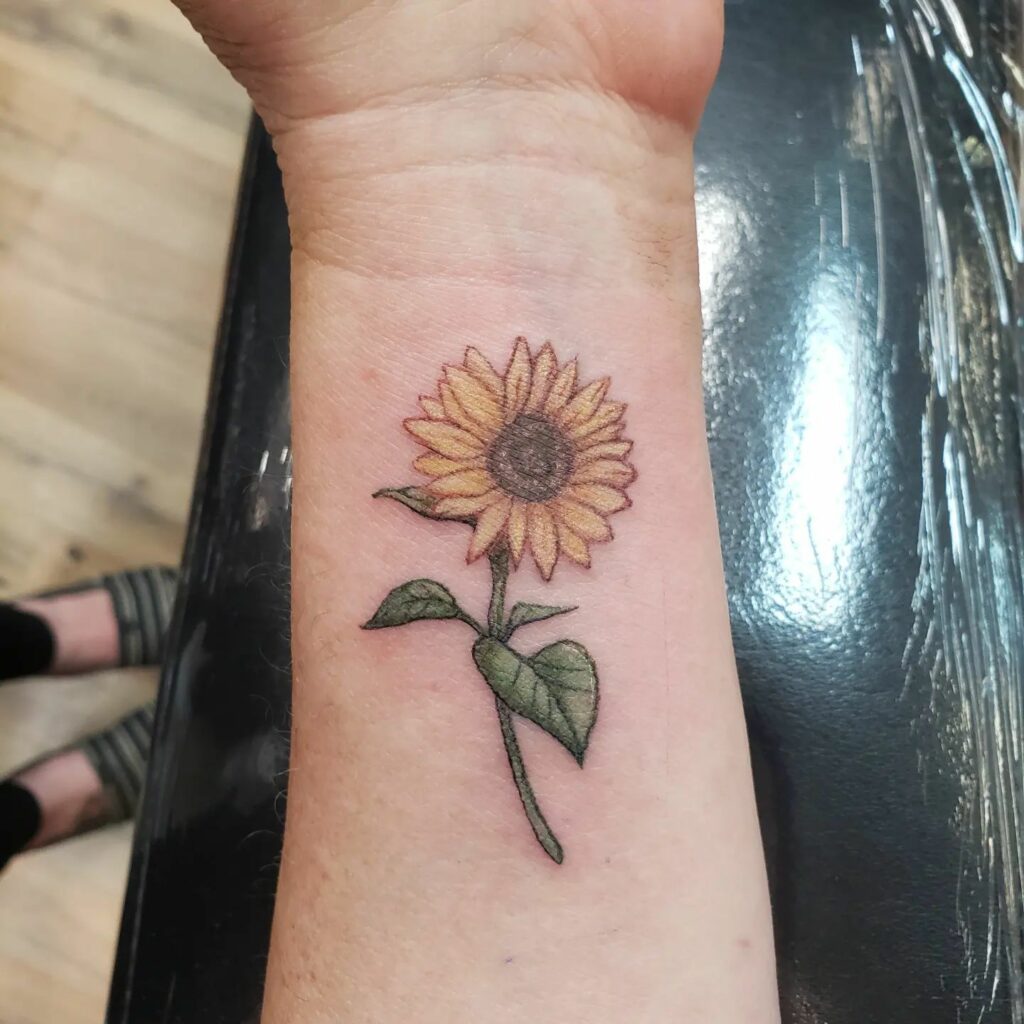 20+ AMAZING WRIST TATTOOS + MEANINGS IN 2024 26 Sunflower Wrist Tattoo