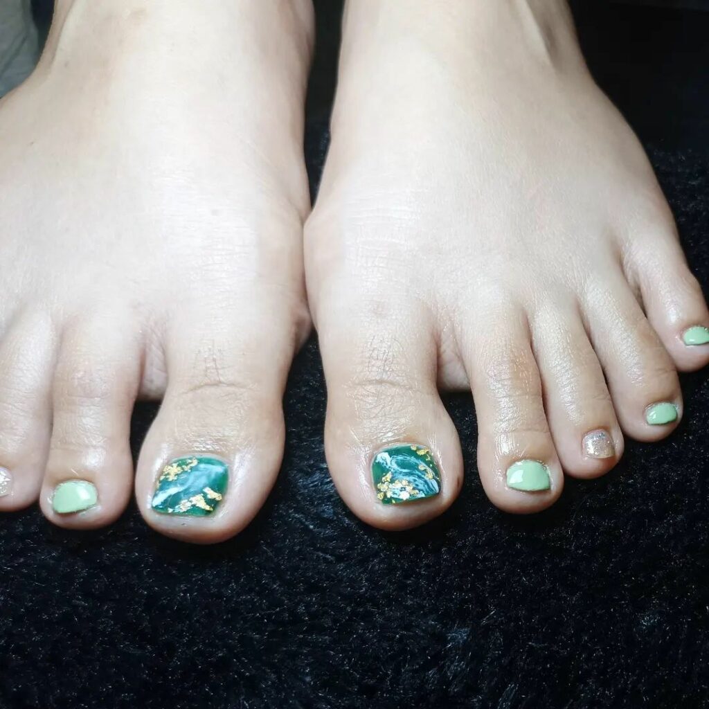 40 Latest Dark Green Pedicure Ideas To Try In 2024! 38 Swirled Marble Dark Green Pedicure