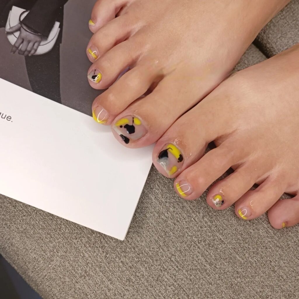 30 Yellow Pedicure Ideas to Brighten Up Your Look in 2024 29 Yellow Pedicure With Black Spots Design