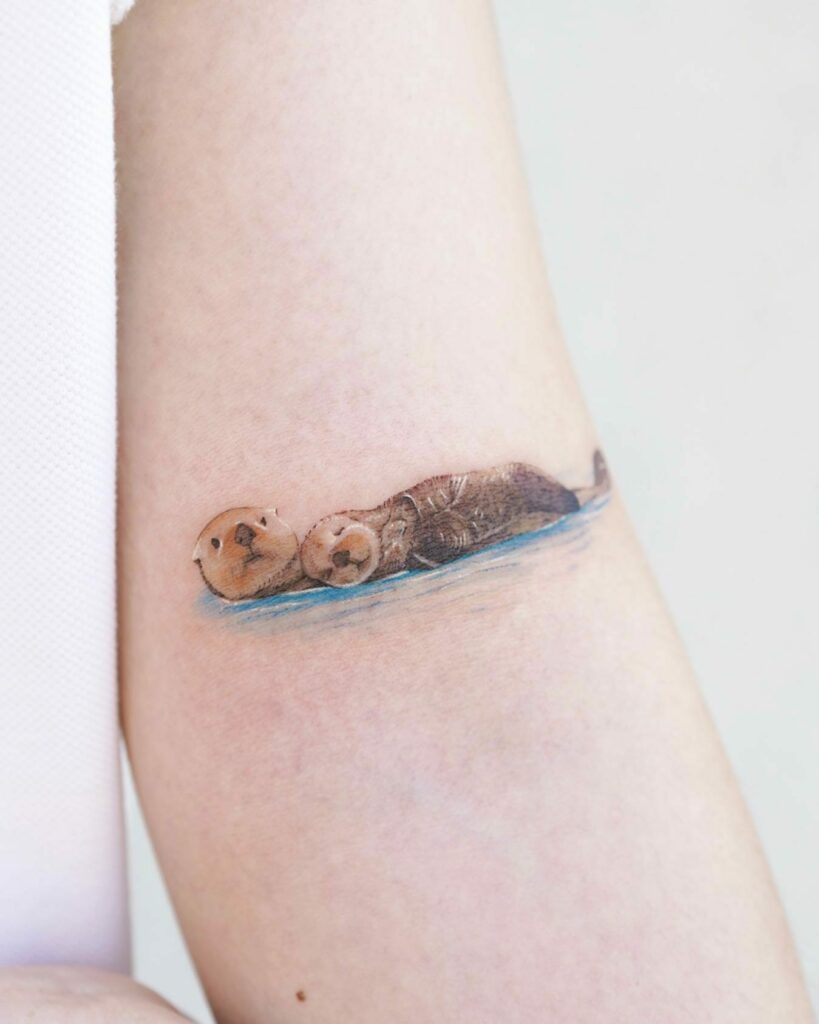 10+ Sea Otter Tattoo Ideas That Will Blow Your Mind! 19 Baby Otter Sleeping On Mother Otter