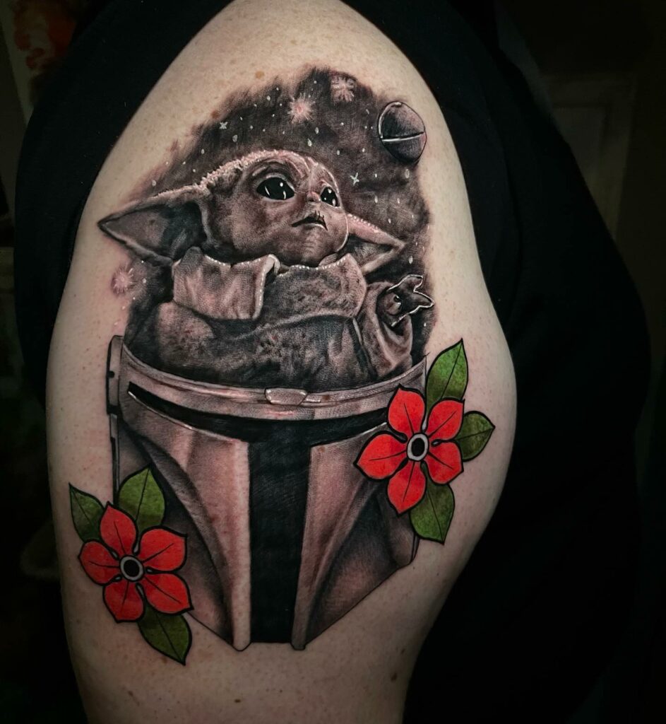 10+ Mandalorian Helmet Tattoo Ideas That Will Blow Your Mind! 19 Baby Yoda Peeping Out Of Mandalorian Helmet Tattoo