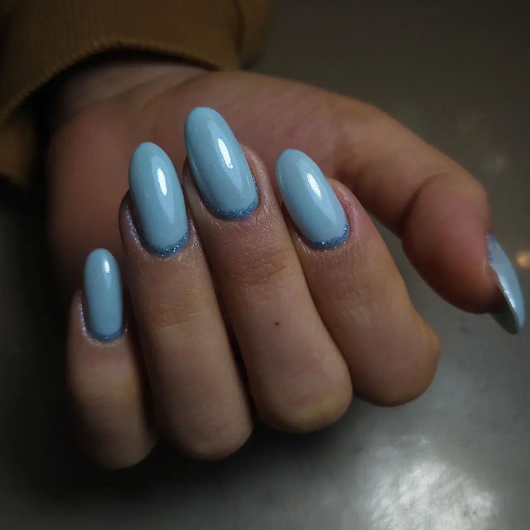 30 Stunning Blue Nail Designs To Try Today ✨ 19 Baby Blue Almond Nails with Glitter Accents