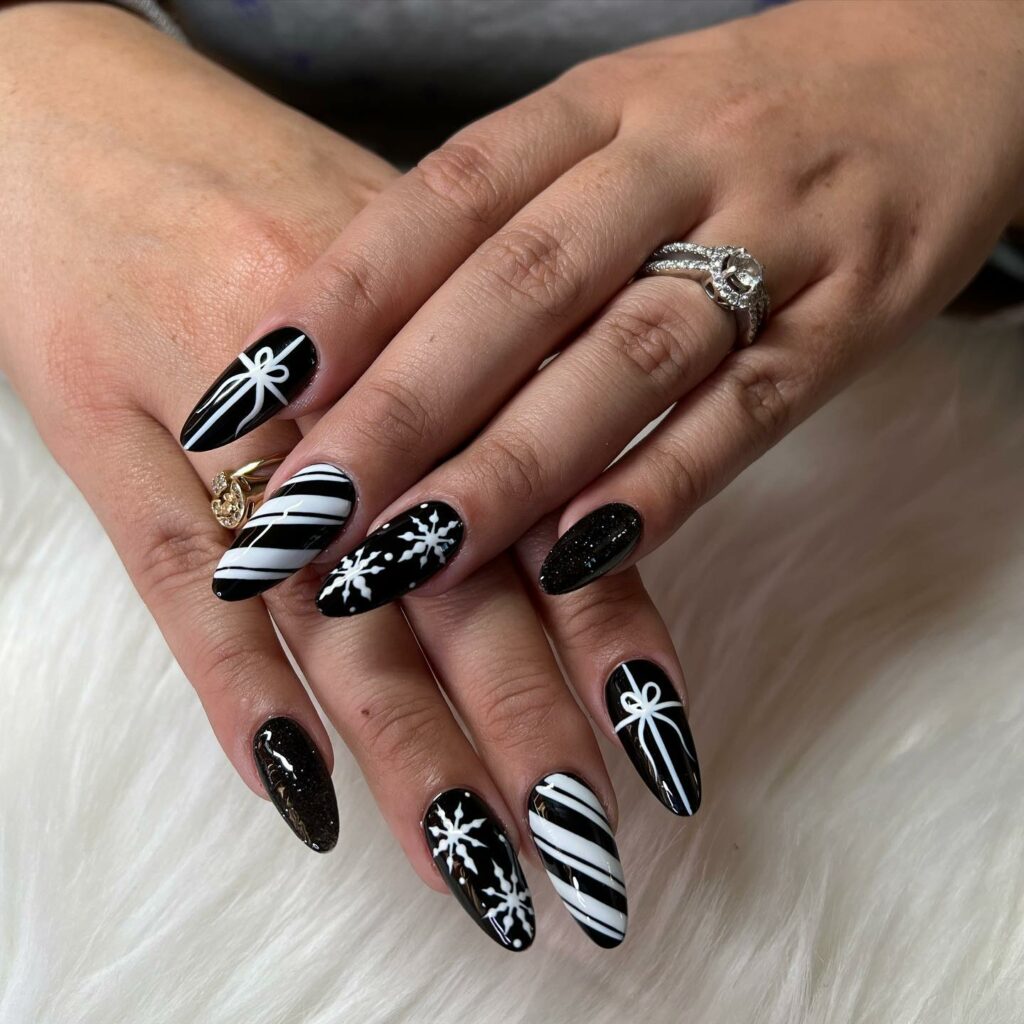 30 Latest Black Almond Nail Ideas To Try In 2024! 26 Black Almond Shaped Nails with Snowflakes