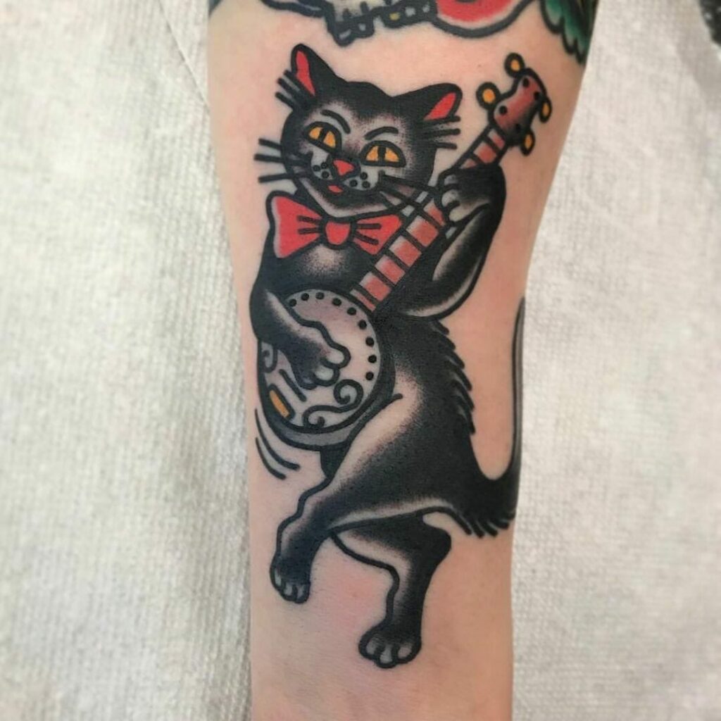 11+ Banjo Tattoo Ideas To Inspire You! 16 Black Cat Playing Banjo Design Tattoo