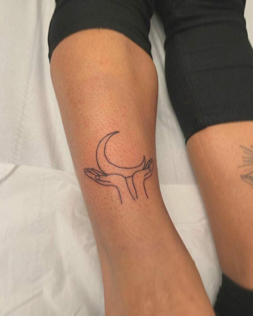 12+ Black Outline Tattoo Ideas To Inspire You! 13 Black Moon In Hands Outline Tattoo