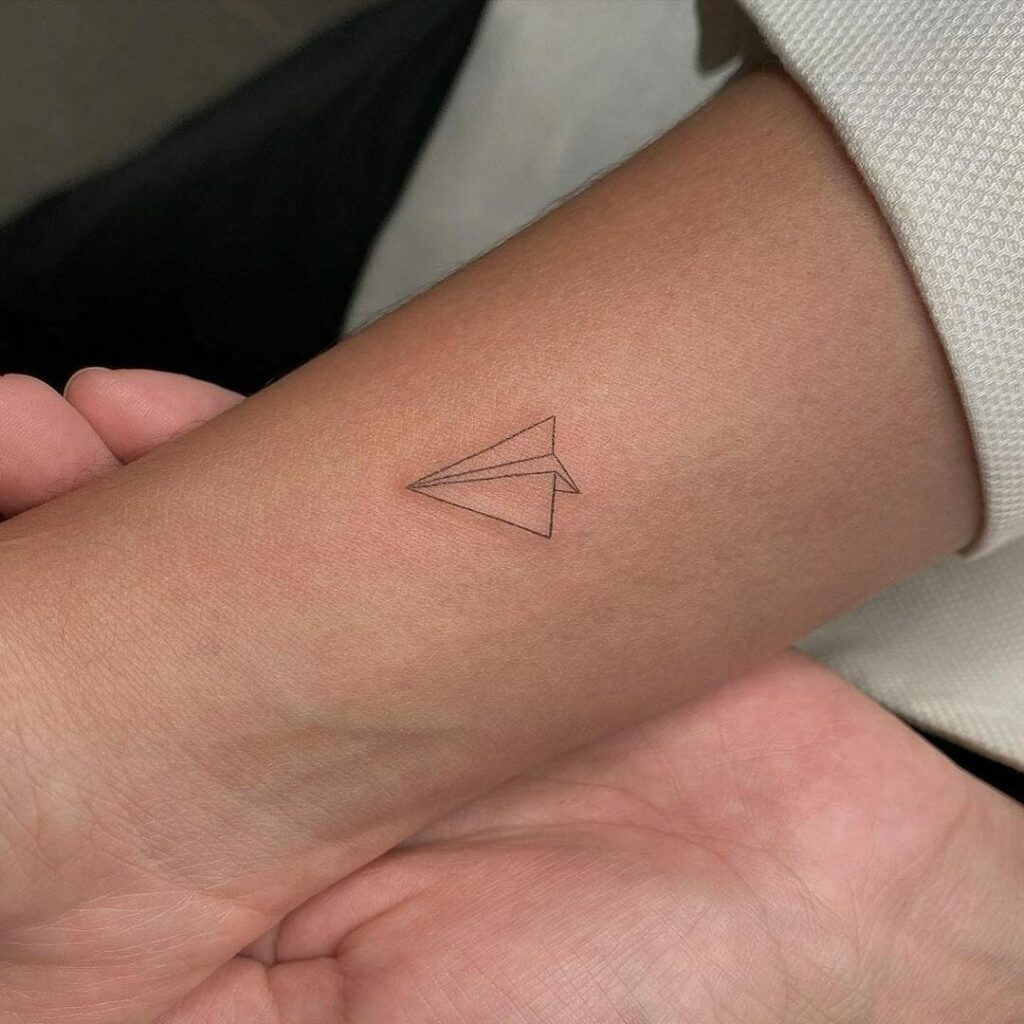 12+ Black Outline Tattoo Ideas To Inspire You! 15 Black Paper Plane Outline Tattoo
