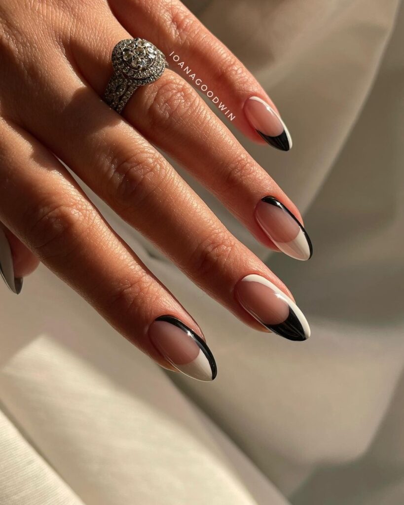 30 Latest Black Almond Nail Ideas To Try In 2024! 48 Black-Tipped French Manicure with a Nude Base