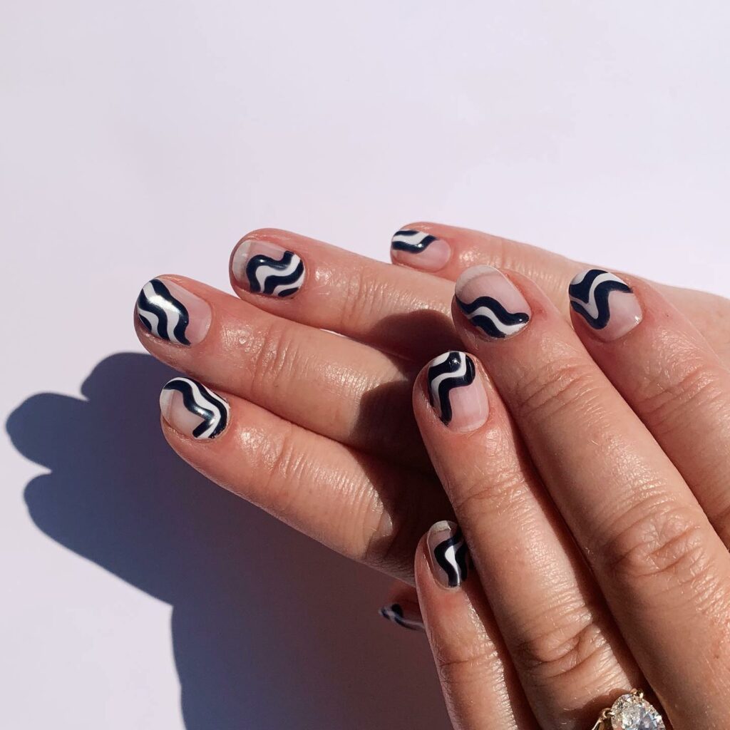 Get Creative with 39 Cute Short Nails Designs for 2024 29 Black and White Nail Art