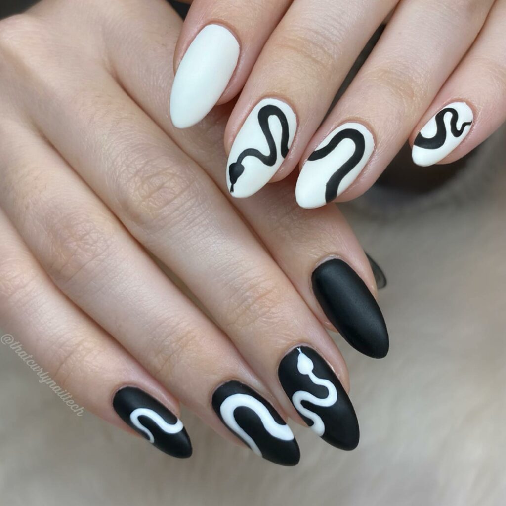 30 Latest Black Almond Nail Ideas To Try In 2024! 35 Black and White Snake Almond Nails