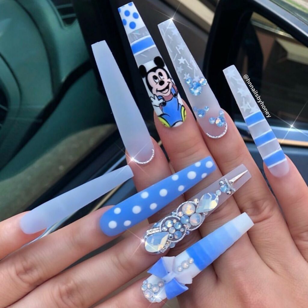 Immerse in Magic with 33 Disney Christmas Nail Ideas in 2024 22 Blue Acrylic Nails with Mickey Mouse Motifs