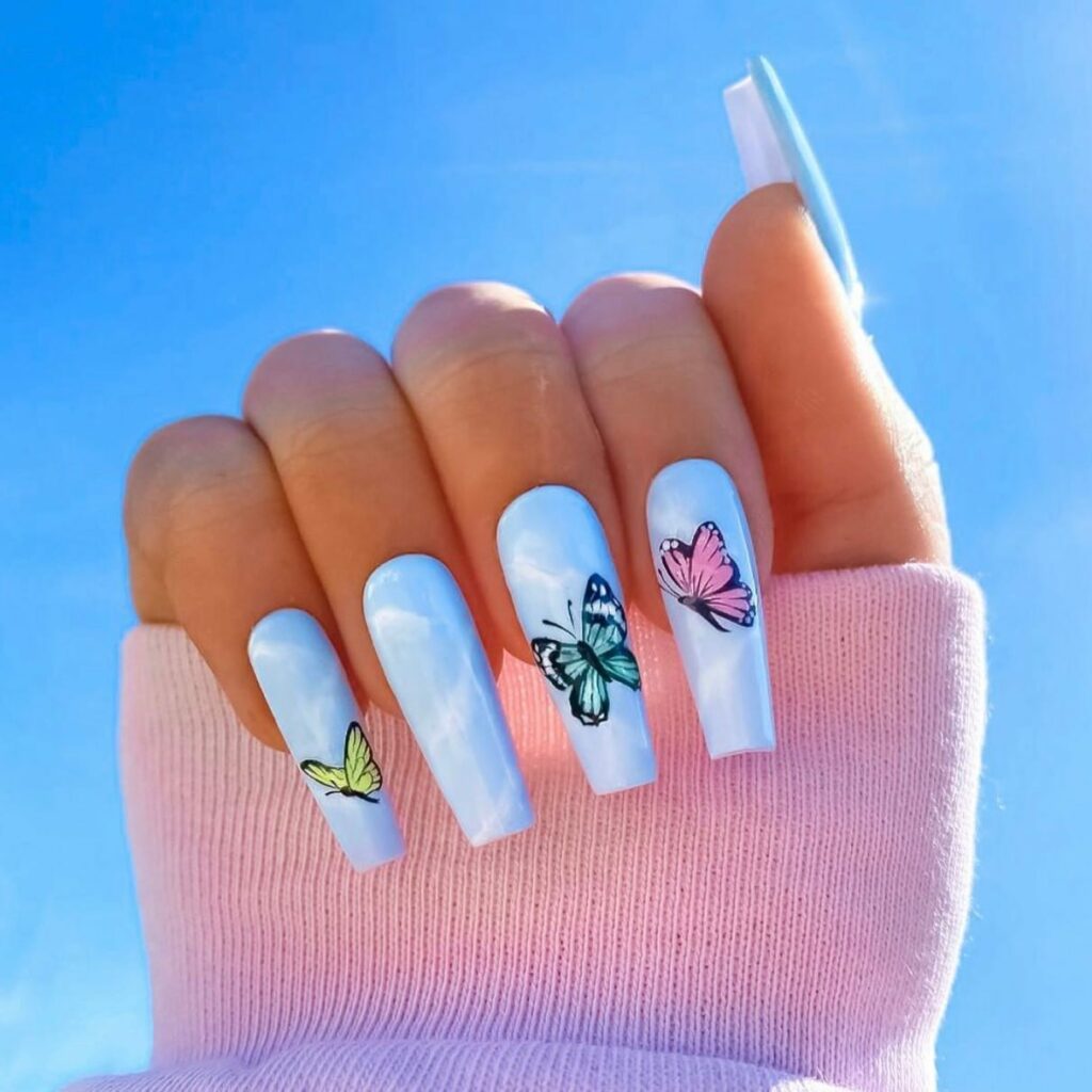 50 Latest Butterfly Nail Designs To try In 2024! 20 Dreamy Butterflies on Blue Nails