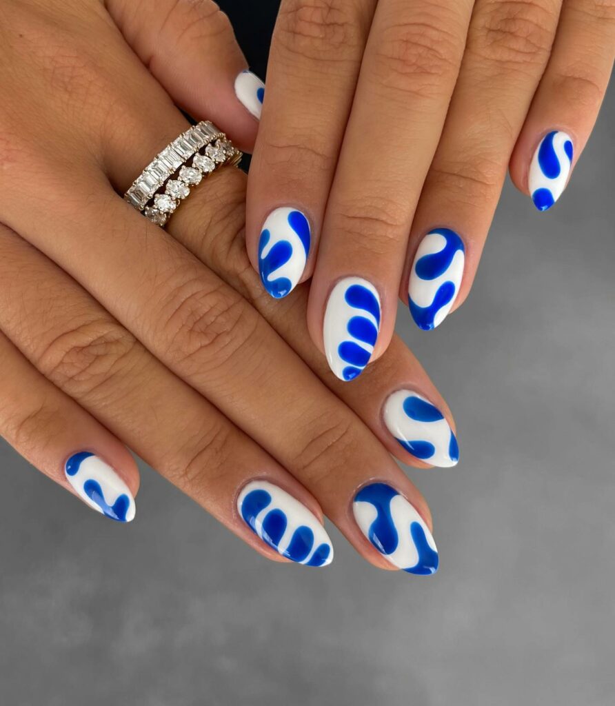 44 Latest White Nail Ideas To Try In 2024! 46 Blue Swirls on White Nails for a Serene Vibe