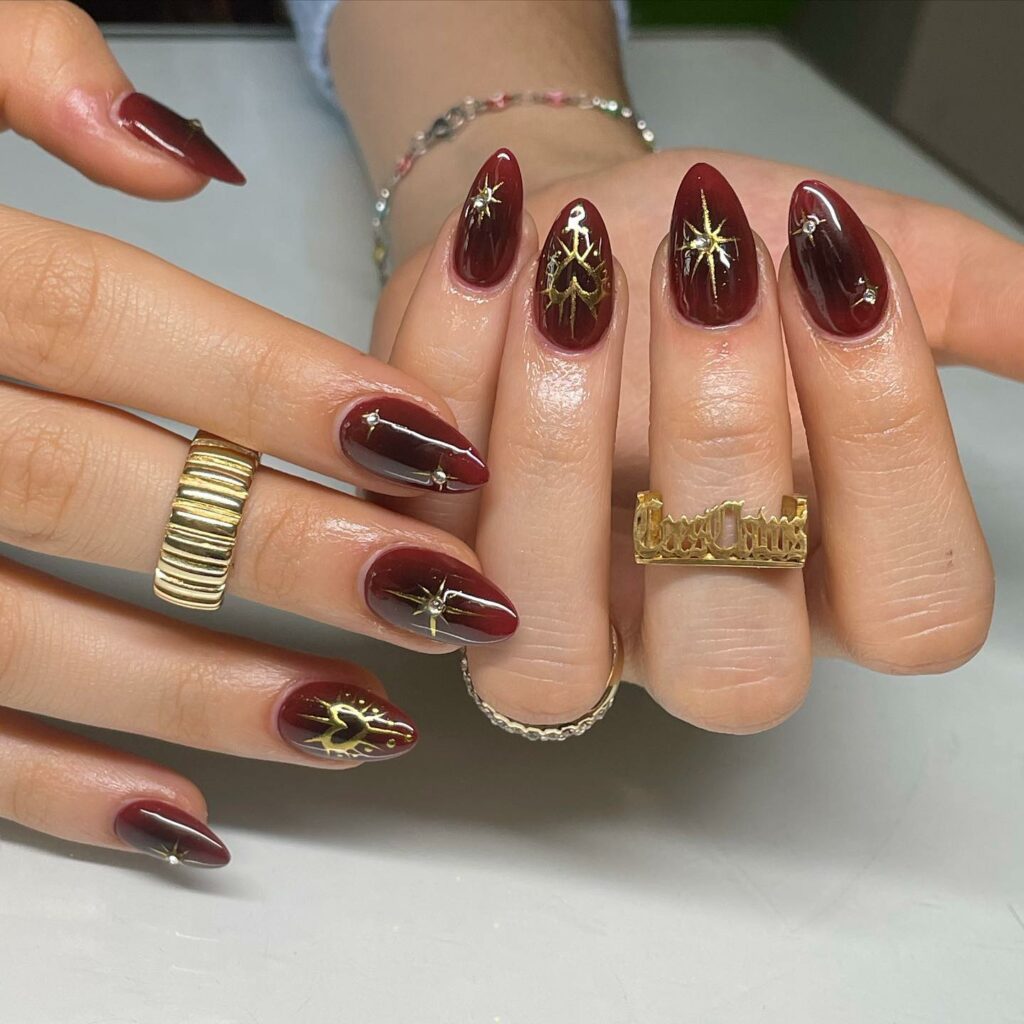 25 Latest Burgundy And Gold Nail Ideas To Try In 2024! 29 Burgundy Nails Adorned with Gold Hearts and Stars