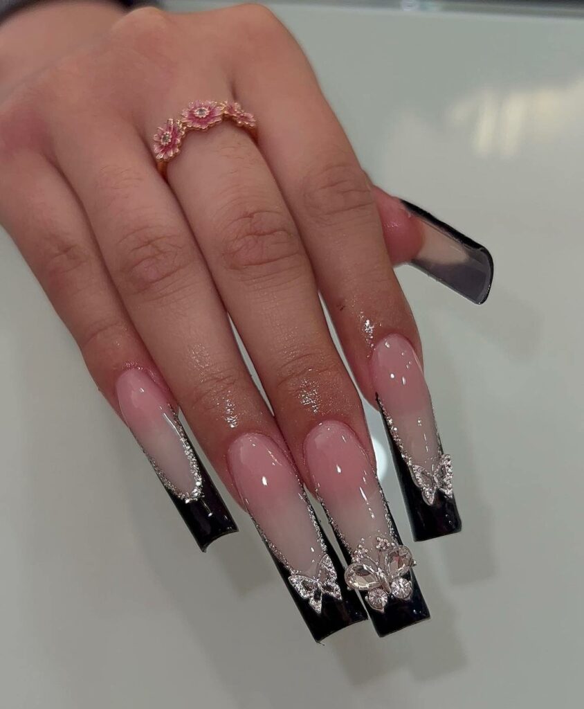 50 Latest Butterfly Nail Designs To try In 2024! 37 Black French Nails with Butterfly Accents