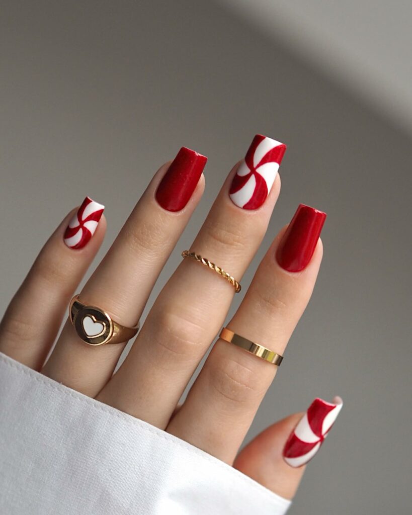 Celebrate with 33 Short Christmas Nail Ideas in 2024 22 Candy Cane Swirl Red Short Christmas Nails