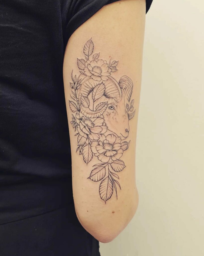 10+ Capricorn Tattoos For Females That Will Blow Your Mind! 13 Capricorn Amidst Flowers Tattoo
