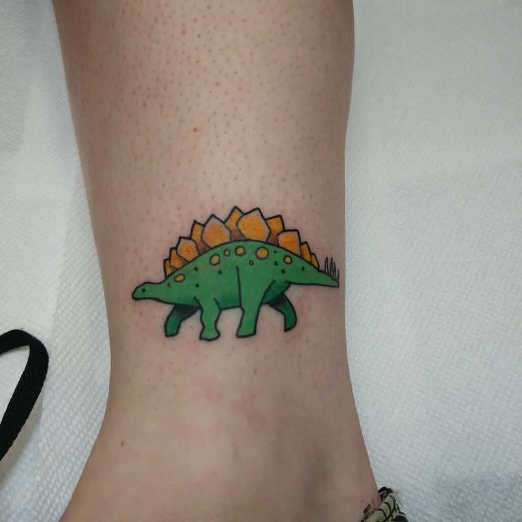 10+ Tiny Dinosaur Tattoo Ideas That Will Blow Your Mind 17 Cartoon Dinosaur Tattoo